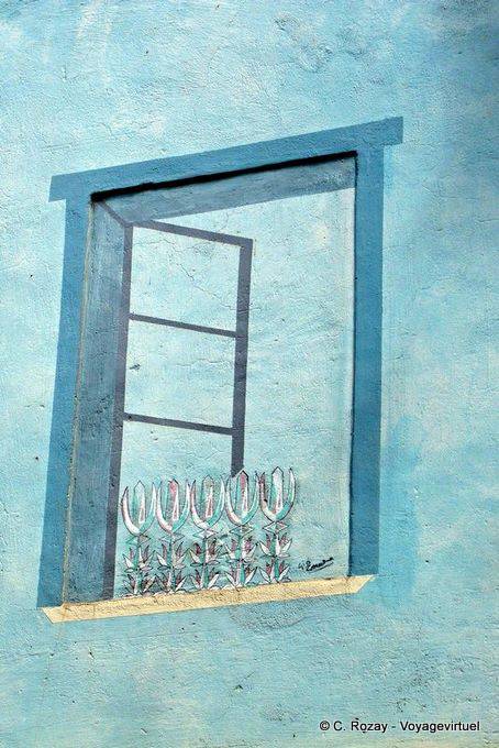 Orgosolo, the window trompe l'oeil, murals - Sardinia