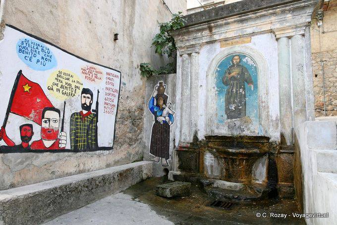 Orgosolo, fountain and Cunzimu Star history, murals - Sardinia
