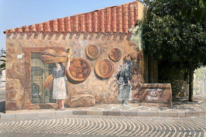 Tinnura, the artisan and the old woman, murals - Sardinia