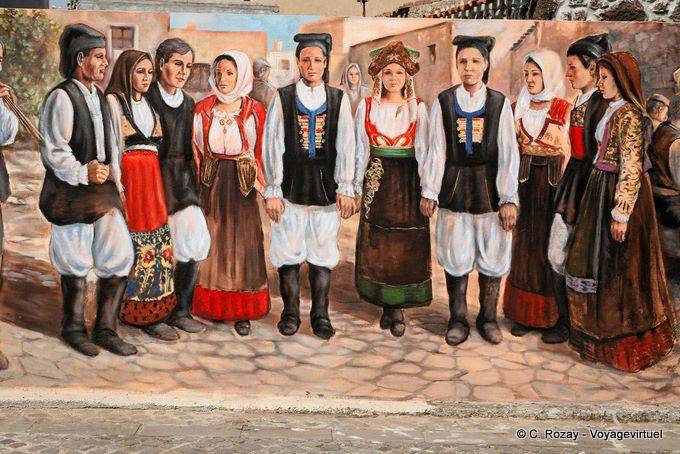 Tinnura, a folk group in costume, mural Via S. Satta - Sardinia
