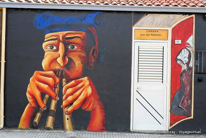 Tinnura, musician and book-shaped door, Via dei murales - Sardinia