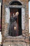 Fonni, wool spinner on the doorstep, mural, Sardinia.