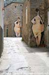 Orgosolo, women painted on the stones, Sardinia.