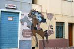 Orgosolo, the rider breaking the wall (Dopo Il Palio), murals, Sardinia.
