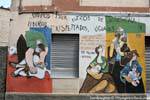 Orgosolo, shearing sheep and family, murals, Sardinia.