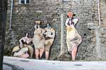 Orgosolo, a group of women, Via D'Azeglio, murals, Sardinia.