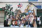 Orgosolo, faces and the Sardinian flag, mural, Sardinia.