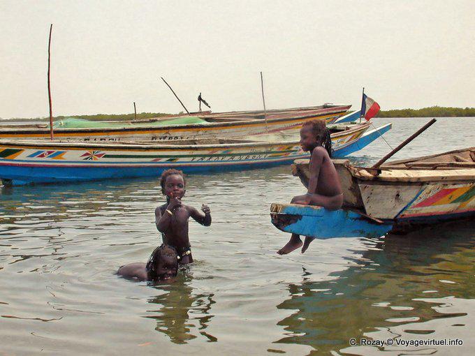Little girls bathing in the river Sine Saloum - Senegal