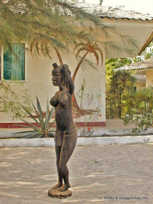 Palms mural and female wooden statue - Senegal