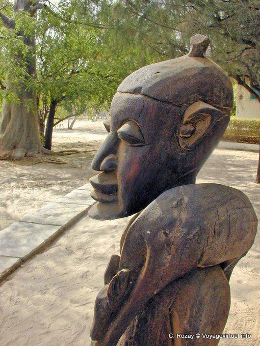 Wooden statue with game on shoulder - Senegal