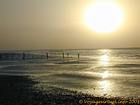 Sun sinking into the waves, Saloum delta, Senegal.