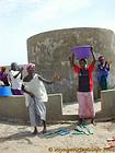 Water singing, dancing woman, Senegal.
