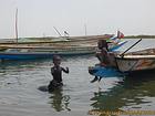 Little girls bathing in the river Sine Saloum, Senegal.