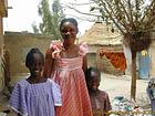 Smiling children in the courtyard of the box, Senegal.
