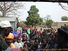 Faces during a distribution of gifts in a village in Saloum, Senegal.