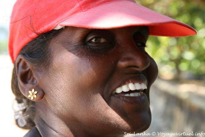 Flower in the ear of the vendor with cap, Beruwela - Sri Lanka Ceylon