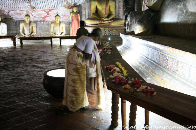 Offerings and prayers to the Buddha parinirvana, Raja Maha Vihara, Dambulla - Sri Lanka Ceylon