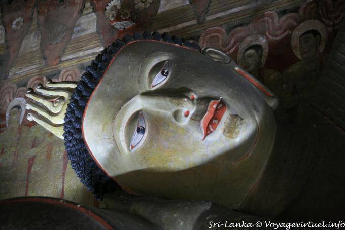 Head and lying next to the buddha, Devaraja lena, Dambulla - Sri Lanka Ceylon