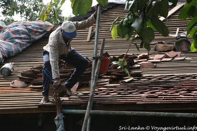 Sri Lankan roofer working on a roof, Kandy - Sri Lanka Ceylon