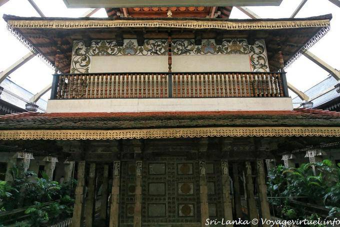 The rear exterior of the ancient Temple of the Tooth in the Golden Canopy structure, Kandy - Sri Lanka Ceylon