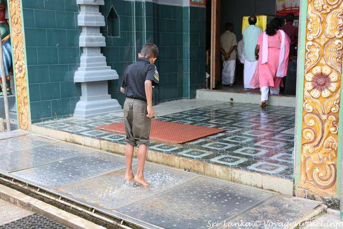 Automatic Washer feet to one of the entrances of the temple, Matale - Sri Lanka Ceylon