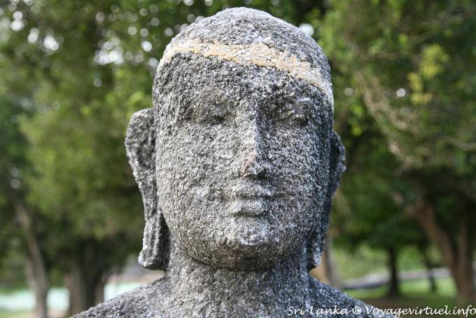 Face serene and marked by time of sitting buddha, Medirigiriya - Sri Lanka Ceylon