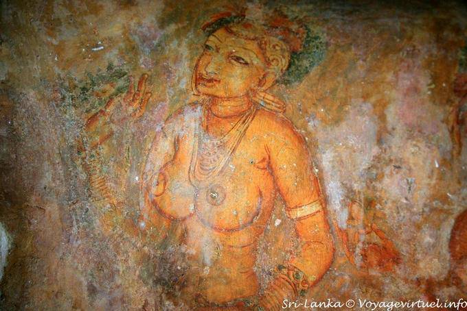 Focus on a woman's bare chest and hand raised, Sigiriya Frescoes of ladies - Sri Lanka Ceylon