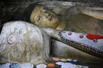 Sleep awakened Buddha entering parinirvana, Raja Maha Dambulla, Sri Lanka Ceylon.