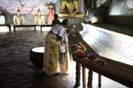Offerings and prayers to the Buddha parinirvana, Raja Maha Vihara, Dambulla, Sri Lanka Ceylon.