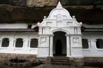 Facade of a cave entrance with carved lions, Temple of the Golden Rock, Dambulla, Sri Lanka Ceylon.