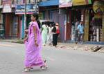 Woman in sari and high heels on a street in Kandy, Sri Lanka Ceylon.