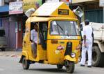 Scooter or yellow tuktuk based vespa, Kandy, Sri Lanka Ceylon.