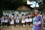 Girls in uniform at the exit of the school, Kandy, Sri Lanka Ceylon.