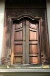 Entourage outside of finely carved door, Temple of the Tooth, Kandy, Sri Lanka Ceylon.