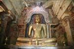 Buddha in meditation with Makara Thorana, Gadaladeniya Temple, Kandy, Sri Lanka Ceylon.
