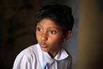 Portrait of young schoolgirl surprised at the temple, Gadaladeniya, Kandy, Sri Lanka Ceylon.