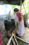 Soaking in boiling water to remove the wax, making batik, Matale, Sri Lanka Ceylon.