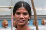 Young woman with bindi adorned with a jewel, Hindu temple Matale, Sri Lanka Ceylon.