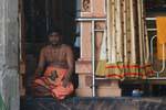 Monk meditative waiting Hindu Temple Matale, Sri Lanka Ceylon.
