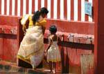 Foot washing for Indian Tamils, Hindu Temple Matale, Sri Lanka Ceylon.
