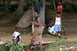 Woman coming out of the bath, Medirigiriya road, Sri Lanka Ceylon.