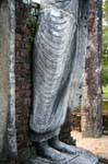 Feet and lower part of the standing Buddha, Temple Medirigiriya, Sri Lanka Ceylon.