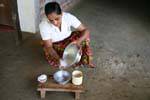 Milk separation and pieces of shredded coconut, Nalanda, Sri Lanka Ceylon.