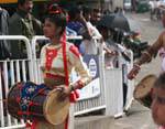 Young woman with drum parade in Nuwara Eliya, Sri Lanka Ceylon.