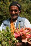 Friendly flower seller to the Falls of Ramboda, Sri Lanka Ceylon.