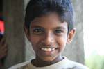 Portrait of a Sri Lankan child, Tea road Nuwara Eliya, Sri Lanka Ceylon.