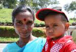 Face of woman with her child, Tea Road, Nuwara Eliya, Sri Lanka Ceylon.