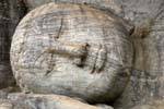 Granite head on the right hand of the Reclining Buddha, Gal Vihara, Polonnaruwa, Sri Lanka Ceylon.