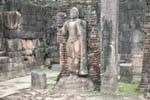 Buddha standing on the terrace of the tooth or Hatadage, Polonnaruwa, Sri Lanka Ceylon.
