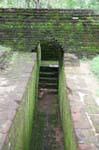Passage in the wall accessing gardens of Sigiriya, Sri Lanka Ceylon.